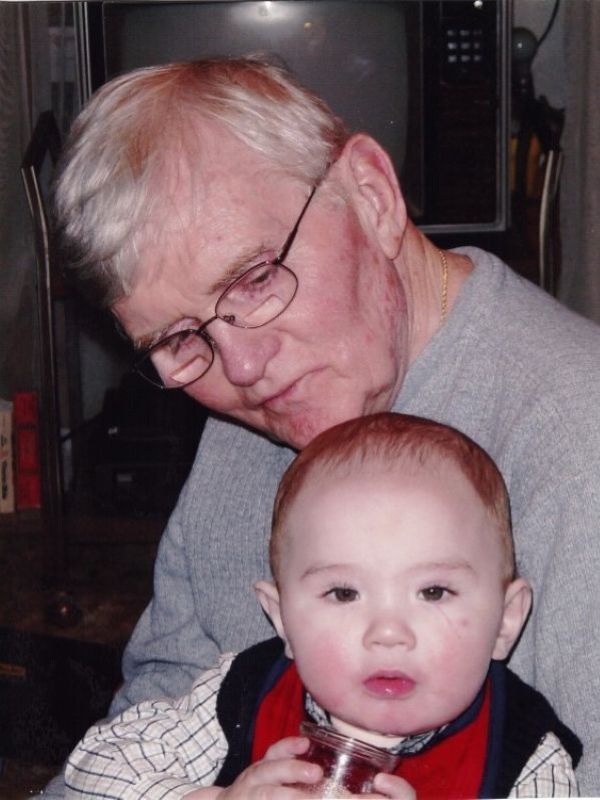 Paul holding infant TJ